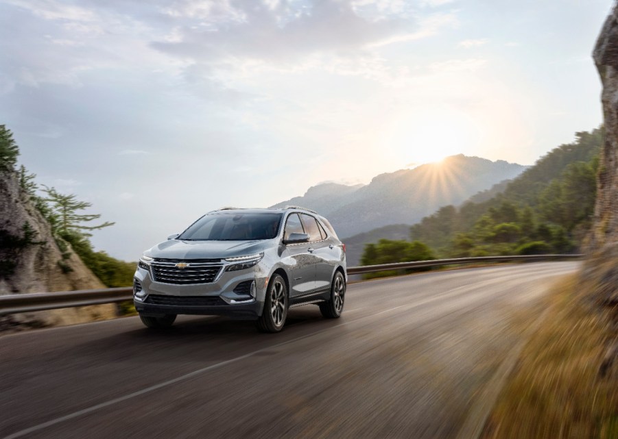 A 2023 Chevrolet Equinox driving down a winding road.