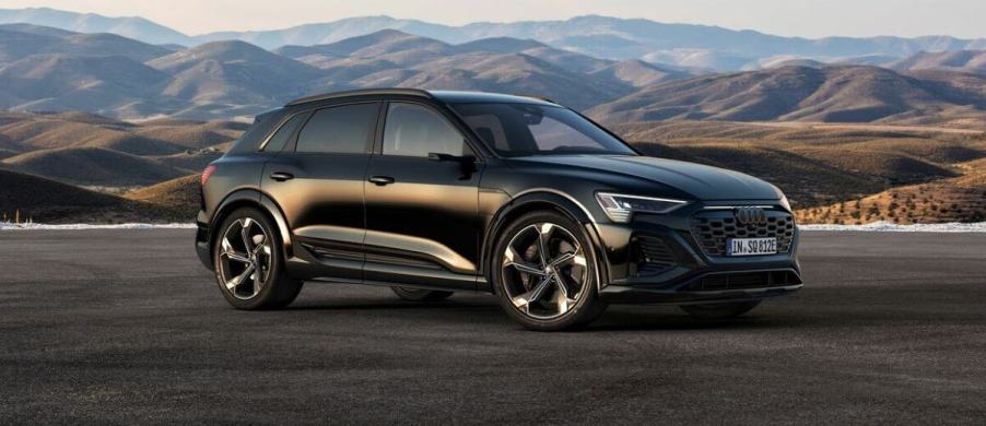 A dark-colored 2024 Audi SQ8 e-tron all-electric midsize luxury SUV model