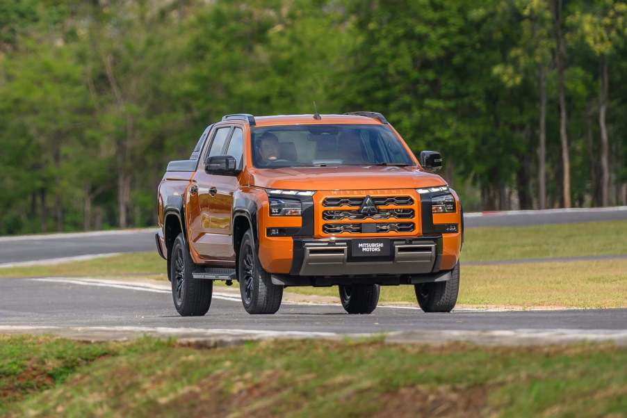 The 2024 Mitsubishi Triton driving around a track