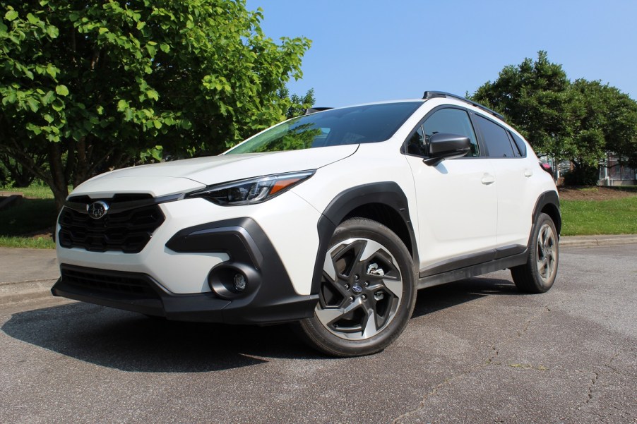 The 2024 Subaru Crosstrek parked near green trees