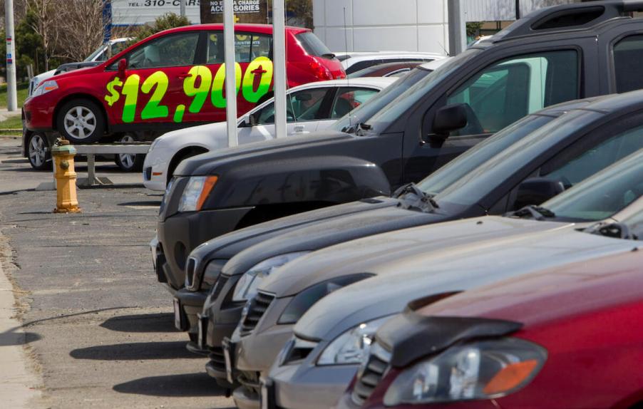 A line of cars on a dealership lot