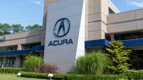 Acura company logo seen on one of their car dealerships showrooms.