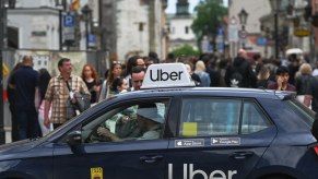 Uber taxi services car with Uber signage