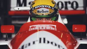 Ayrton Senna in his car before a race.