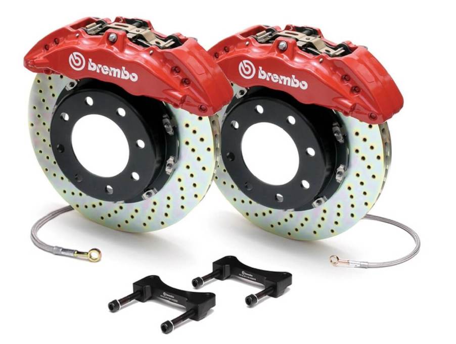 A set of aftermarket Brembo drilled and slotted performance brake rotors and calipers.