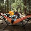 People relaxing at their camp site on a campground.