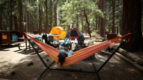 People relaxing at their camp site on a campground.