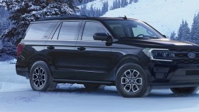 A black 2023 Ford Expedition full-size SUV is parked in the snow.