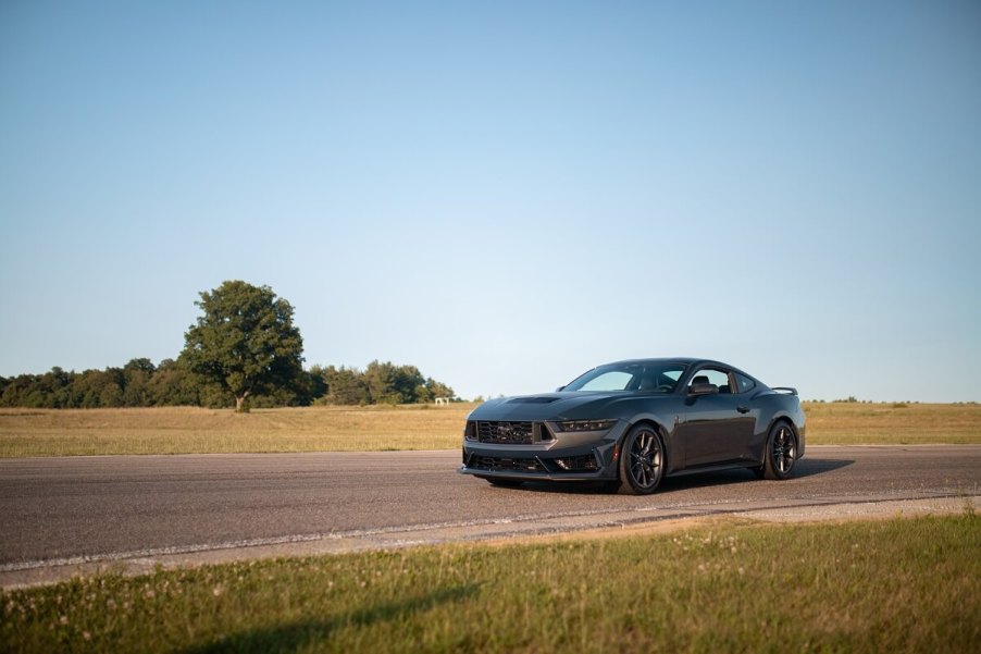 A Ford Mustang Dark Horse R without a racing livery sits on a track.