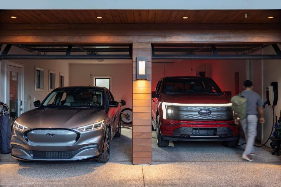 Ford's Mustang Mach-E compact SUV and F-150 Lighting full-size pickup truck electric vehicles in a home garage