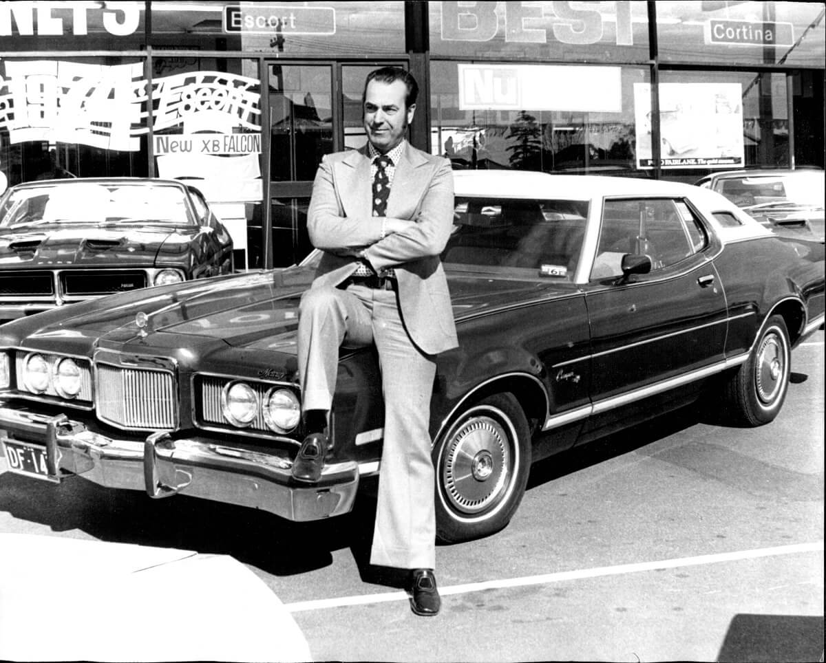 A second-generation Mercury Cougar on a lot.