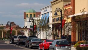 Cars parallel parked on a main street down town