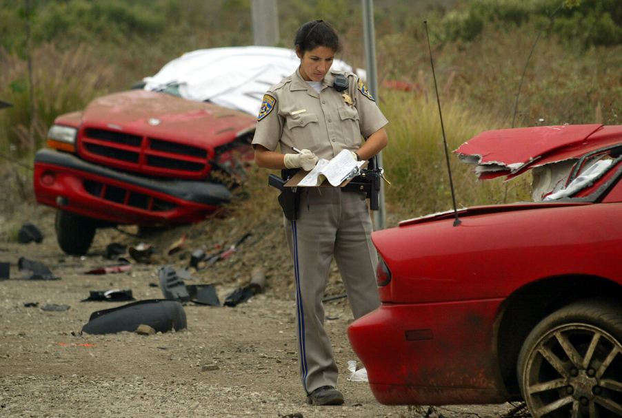 Red 2002 Ram truck accident with Camaro