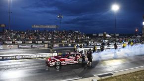 NHRA Pro Stock racing at Bandimere Raceway as dark settles