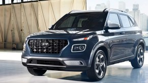 A blue 2023 Hyundai Venue subcompact SUV is parked.