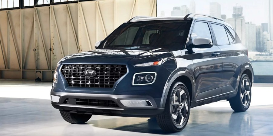 A blue 2023 Hyundai Venue subcompact SUV is parked.