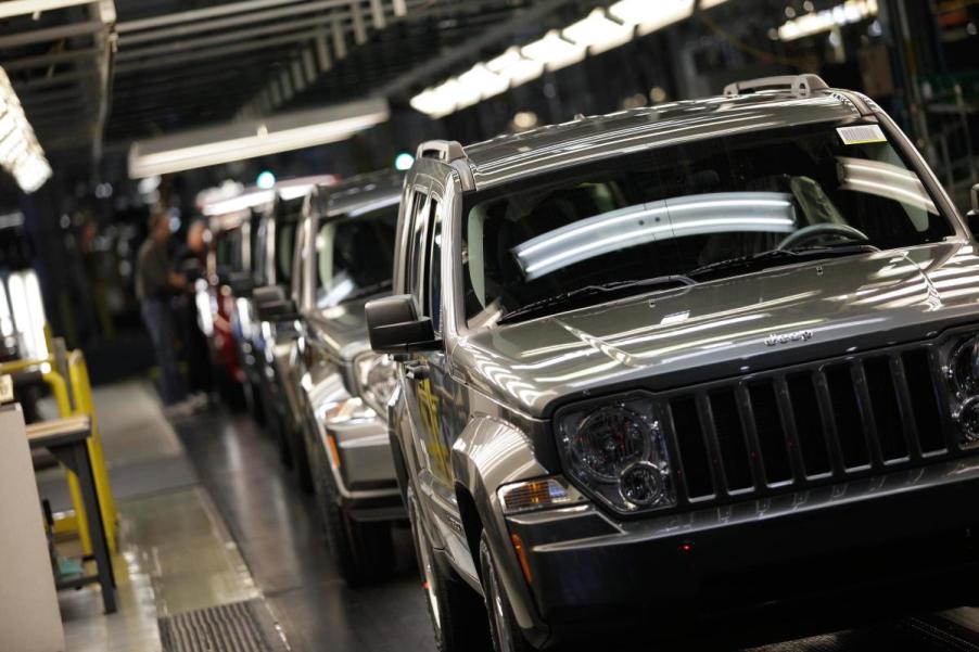 A row of Jeep Liberty SUVs on the assembly line.