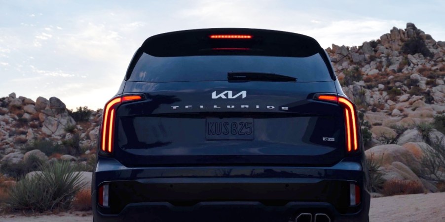 The back of a blue 2024 Kia Telluride midsize three-row SUV.