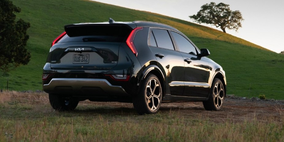 The back of a black 2023 Kia Niro subcompact hybrid SUV. 