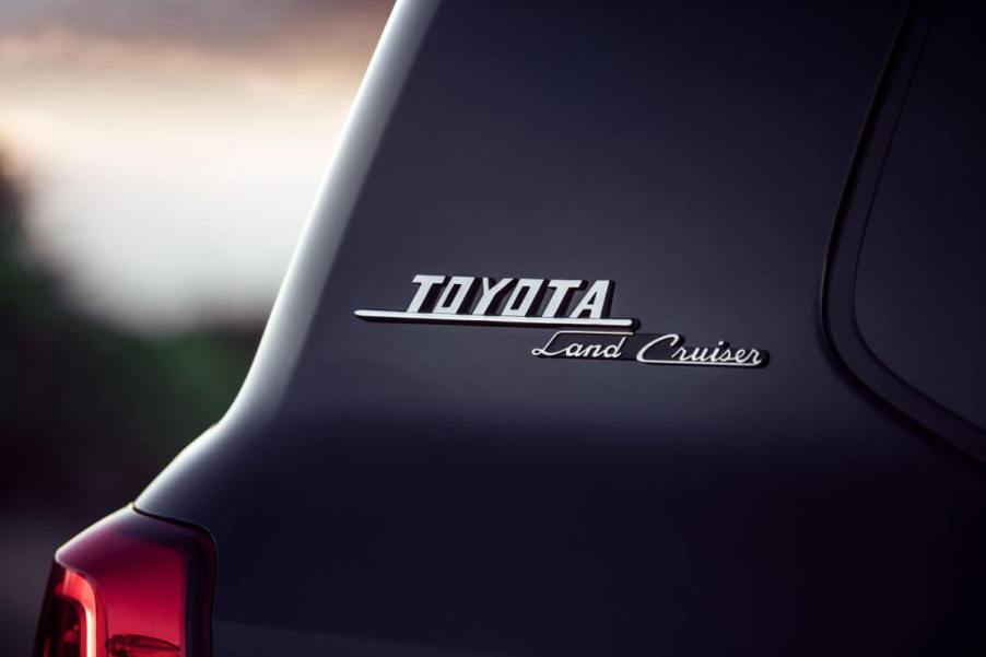 Badging for the make and model names near the rear window of a Toyota Land Cruiser full-size off-road SUV