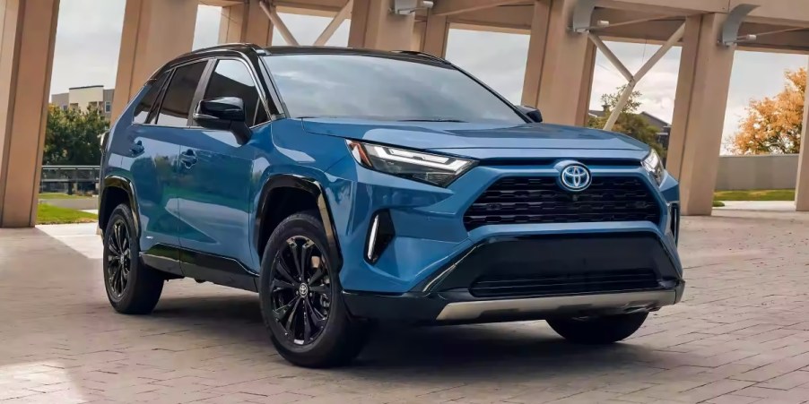 A blue 2023 Toyota RAV4 Hybrid small hybrid SUV is parked.