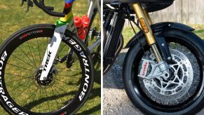 The brakes on the front wheel of a Trek bike with Pirelli tires (L) and a 2019 Triumph Thruxton motorcycle (R)