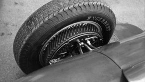 A black and white photo of a front drum brake on a Ferrari 246 F1