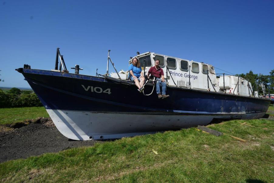 Martyn Steedman and Louise cross glamping on a RNLI lifeboat lowered onto their Mains Farm property