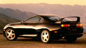 A rear angled view of a black Toyota Supra