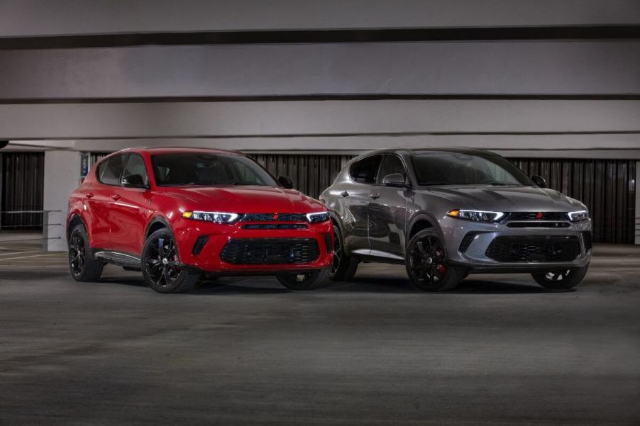 (L to R) red and gray 2024 Dodge Hornet compact SUV model in a parking garage