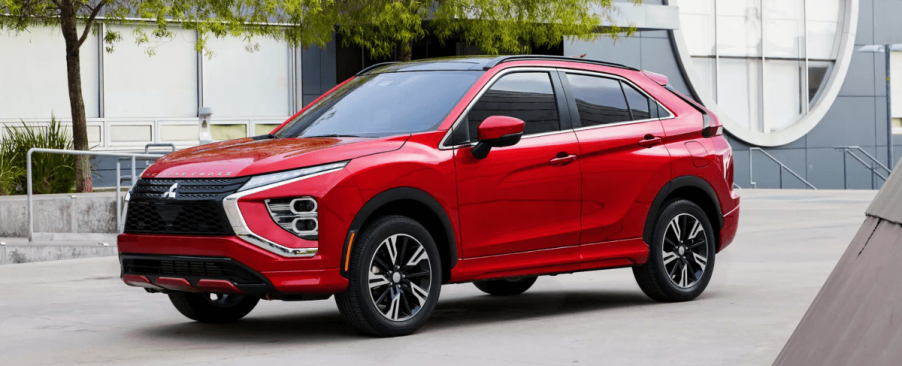 A 2024 Mitsubishi Eclipse Cross compact crossover SUV model in the Red Diamond paint color option