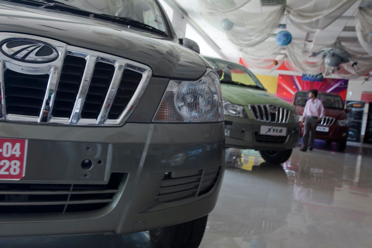 Two new cars in a dealer showroom