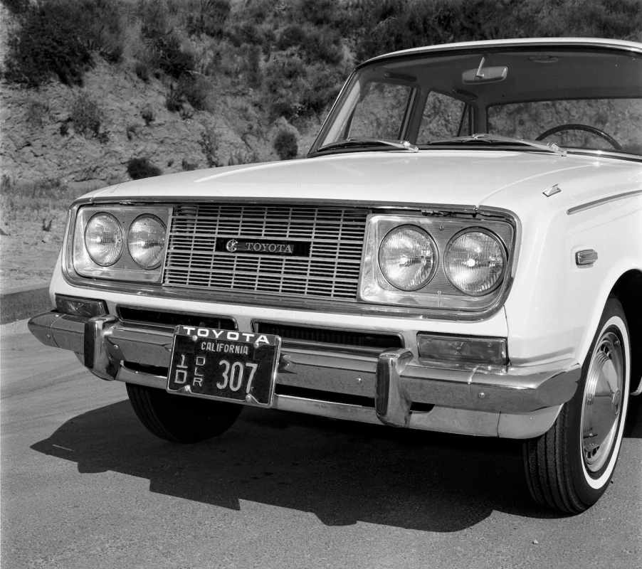 The Toyota logo in the grille of a 1966 Corona sedan.