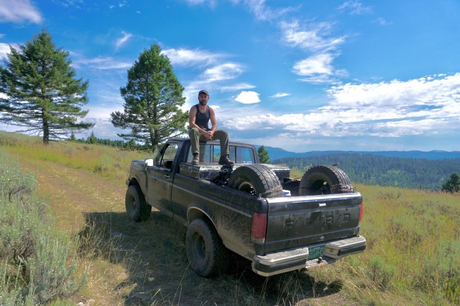 Henry Cesari sits atop his 1988 Ford F-150 while off-roading.