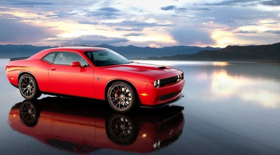 A 2015 Dodge Challenger SRT Hellcat shows off its bright-red color on a salt flat.