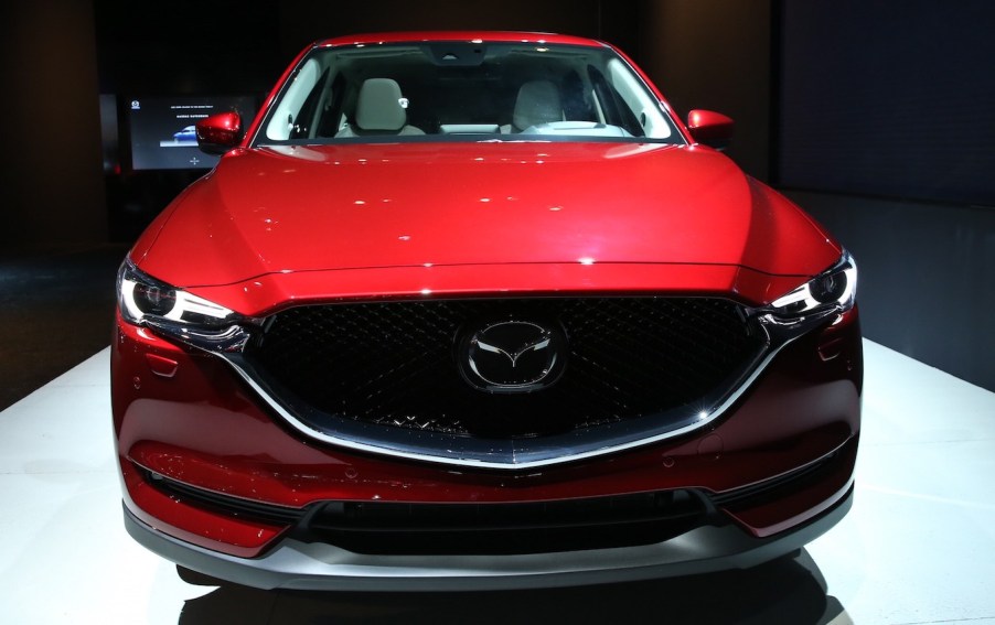 A red 2018 Mazda CX-5, the Ford Escape's competition, at the Brussels Motor Show