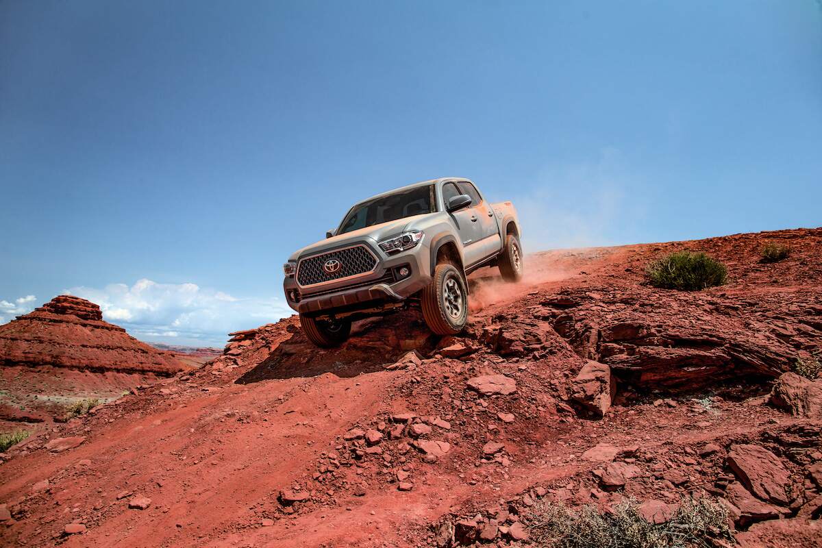 A dusty gray 2018 Toyota Tacoma TRD