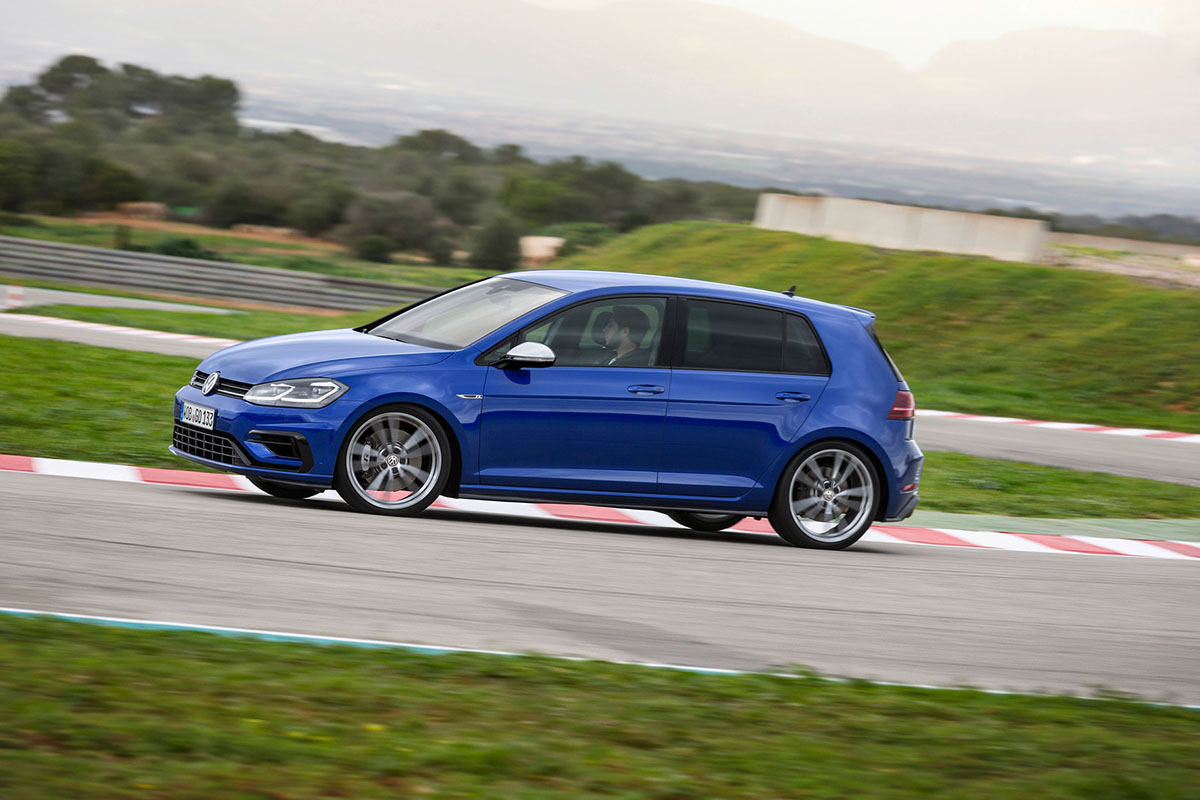 Blue 2018 Volkswagen Golf R on racetrack apexing through corner