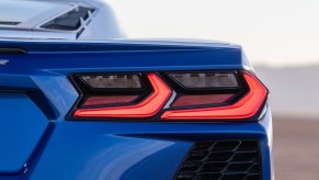 A blue Chevrolet Corvette shows off its rear-end lighting.