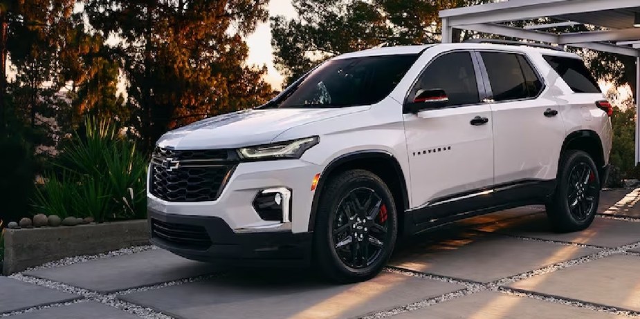 A white 2023 Chevrolet Traverse midsize three-row SUV is parked. 