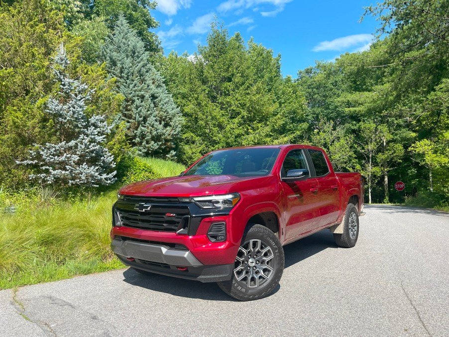 The 2023 Chevy Colorado parked near evergreen trees