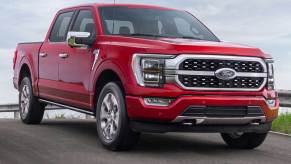 The 2023 Ford F-150 driving down the road with BlueCruise