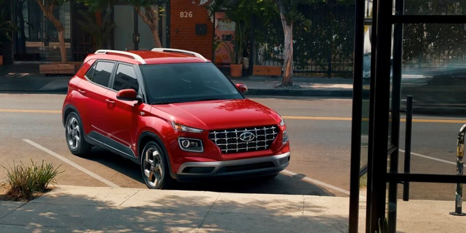 A red 2023 Hyundai Venue subcompact SUV is parked. 