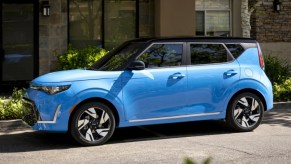 The side of a blue 2023 Kia Soul subcompact SUV.