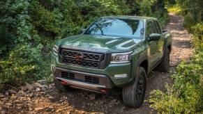 The 2023 Nissan Frontier off-roading in the woods