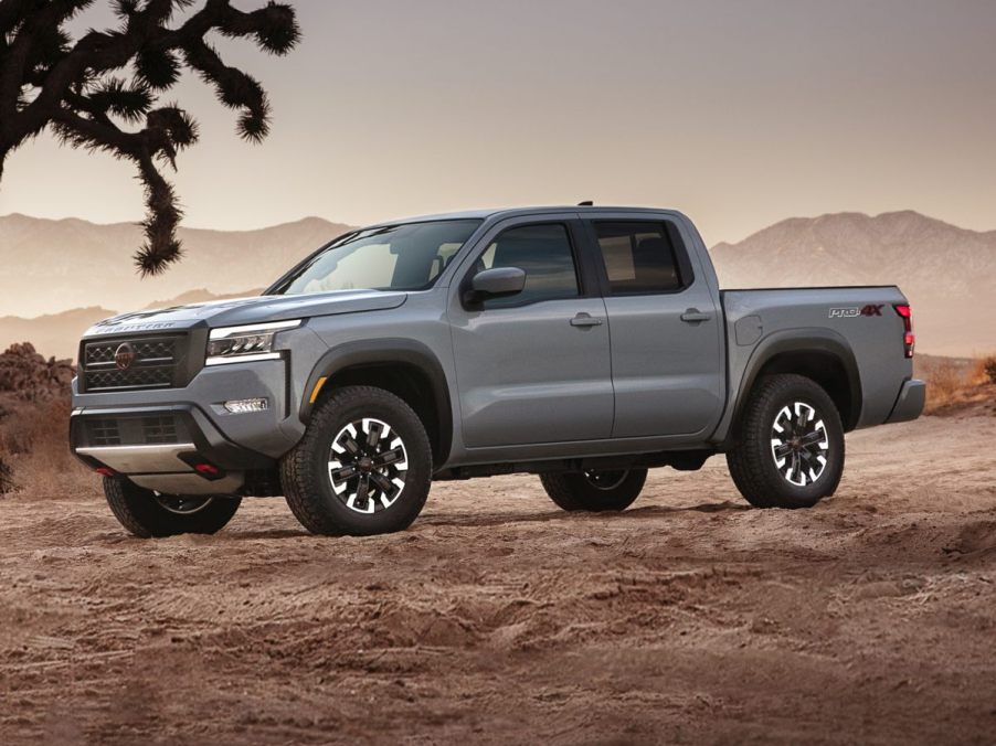 The 2023 Nissan Frontier parked in the desert sand