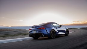 A Mk5 Supra, a 2023 or 2024 Toyota GR Supra model, drives on a track.