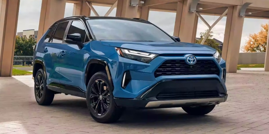 A blue 2023 Toyota RAV4 Hybrid small hybrid SUV is parked. 