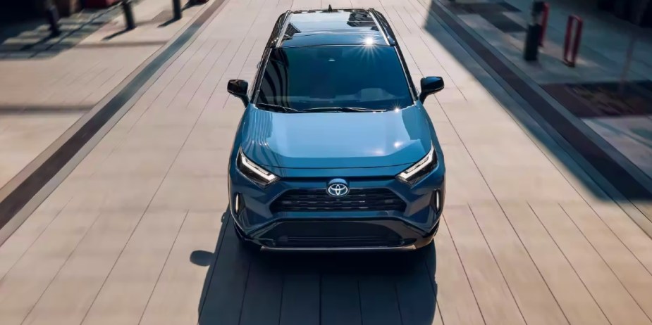 A blue 2023 Toyota RAV4 Hybrid small hybrid SUV is parked. 