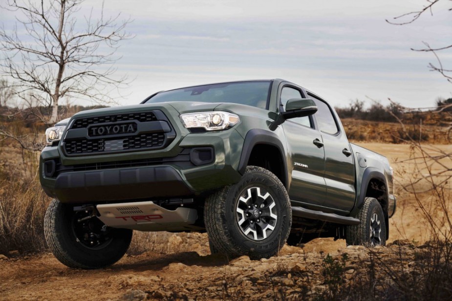 The 2023 Toyota Tacoma off-roading over rocky terrain 